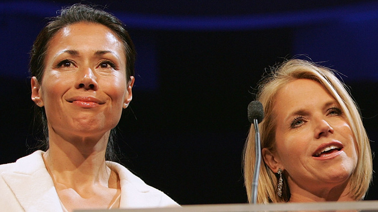 Ann Curry smiling with Katie Couric