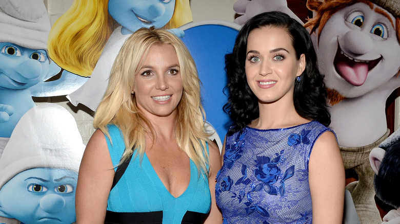 Britney Spears and Katy Perry wearing blue dresses