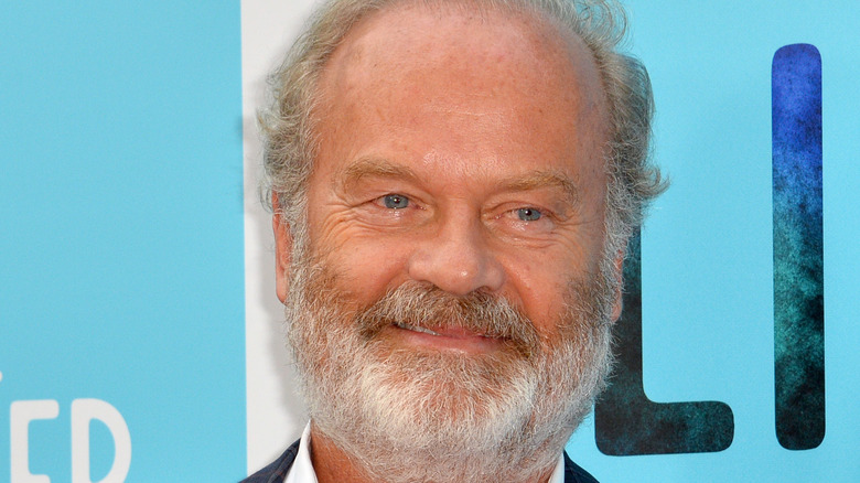 Kelsey Grammer smiling on red carpet