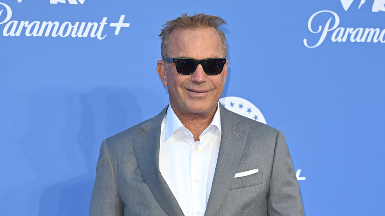 Kevin Costner sunglasses smiling