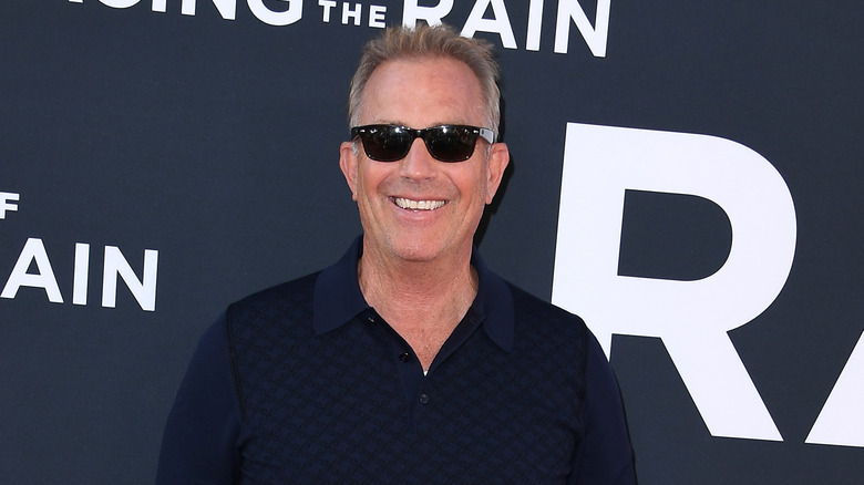 Kevin Costner sunglasses smiling