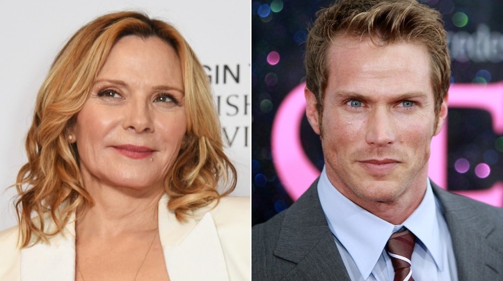 Kim Cattrall smirking, Jason Lewis posing