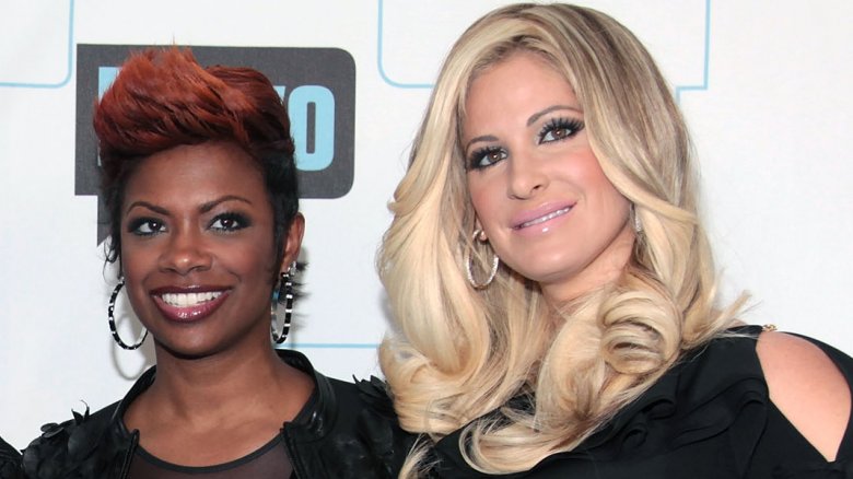 Kim Zolciak-Biermann and Kandi Burrus smiling