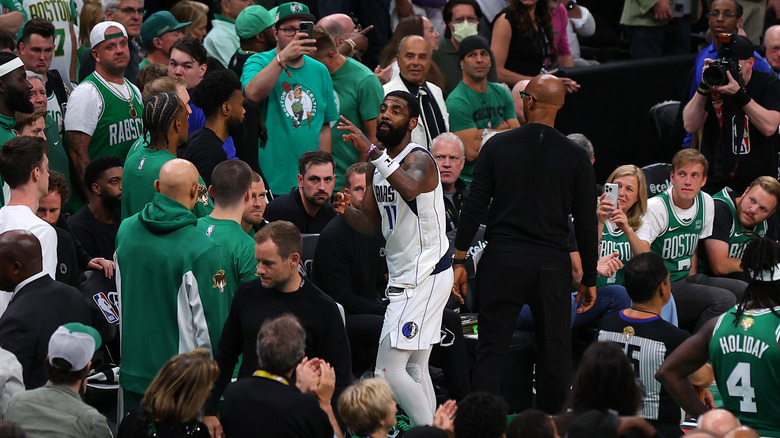 Kyrie Irving gesturing to Celtics fan