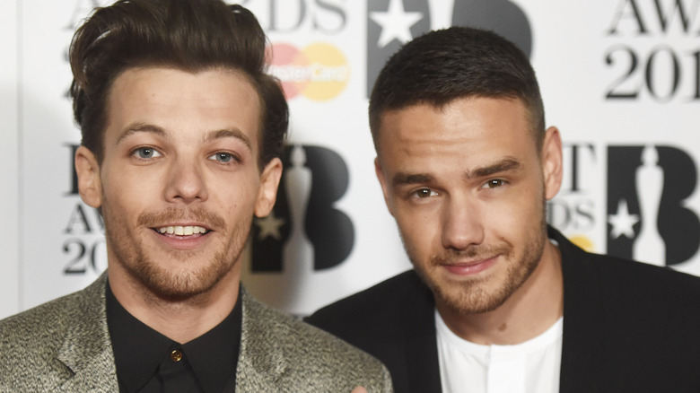 Liam Payne and Louis Tomlinson both smiling