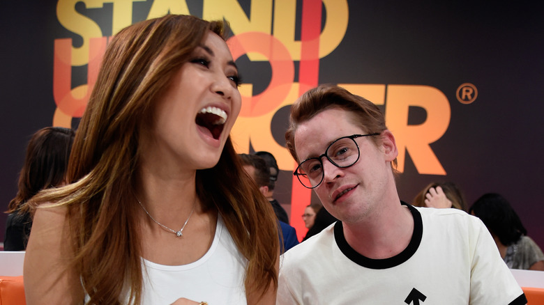 Brenda Song and Macaulay Culkin smiling