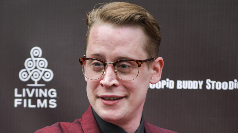 Macaulay Culkin wearing red blazer