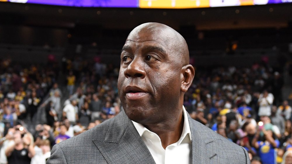 Magic Johnson on basketball court, looking away