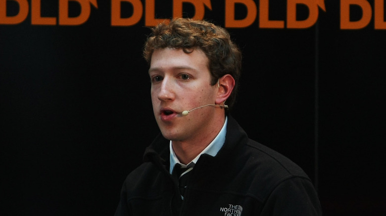 Mark Zuckerberg speaking into mic jacket