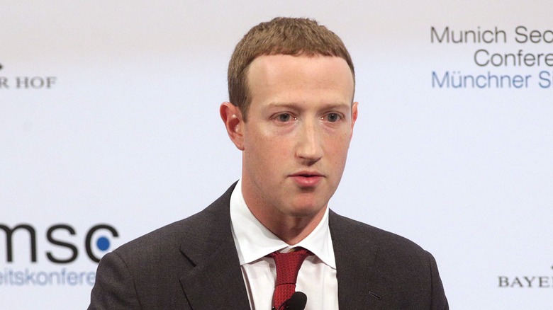 Mark Zuckerberg in red tie suit