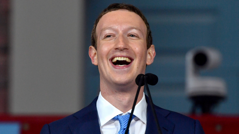 Mark Zuckerberg blue suit mic laughing