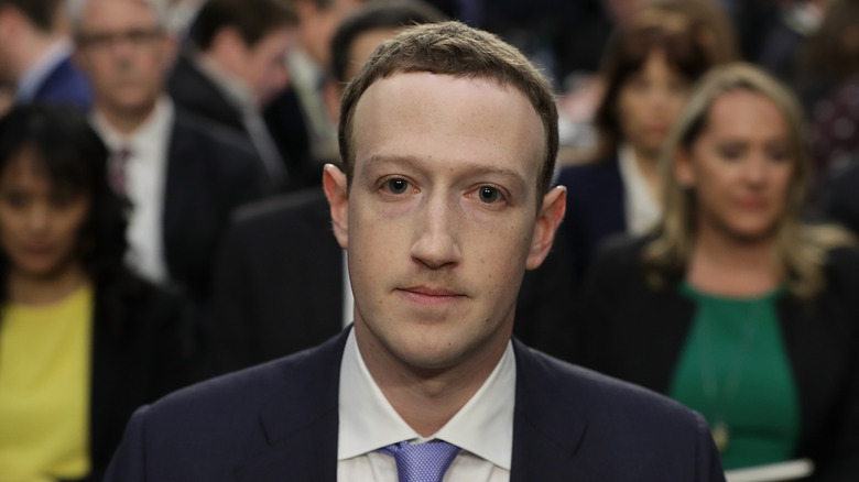 Mark Zuckerberg in blue tie suit at hearing