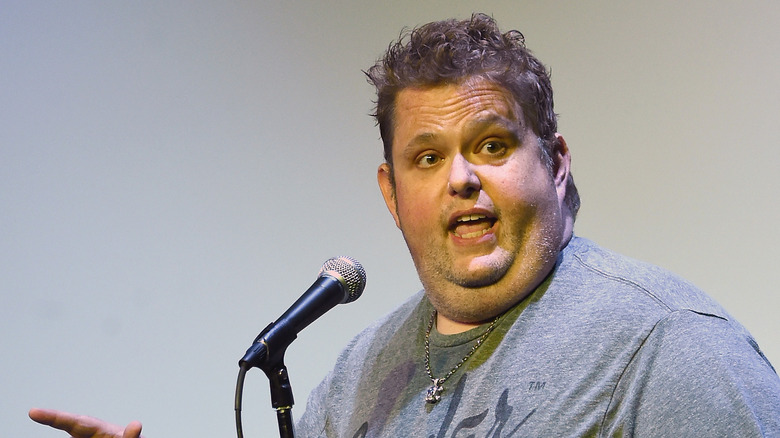 Ralphie May with microphone