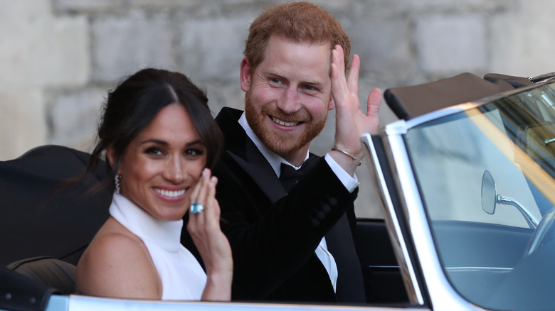 Prince Harry and Meghan Markle waving