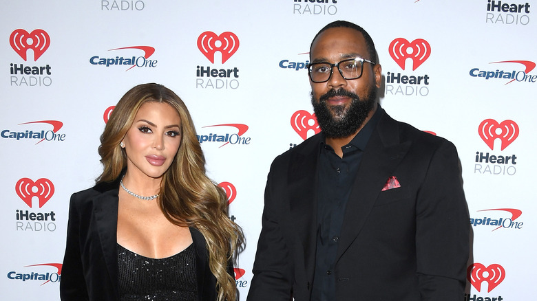 Larsa Pippen and Marcus Jordan stand at iHeart Radio event