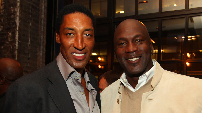 Scottie Pippen standing with Michael Jordan