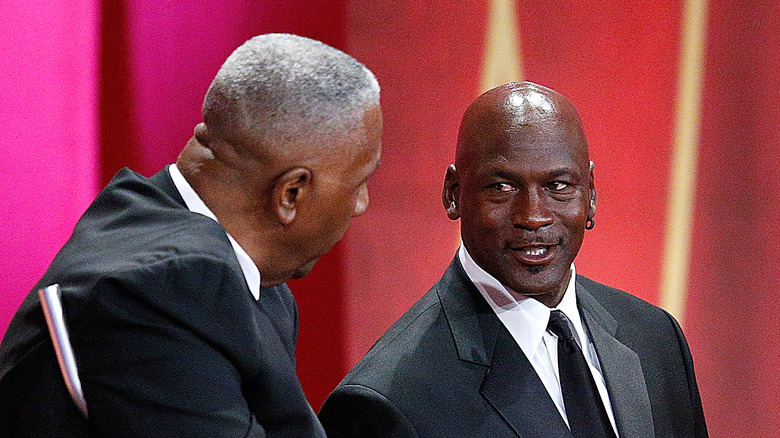 Michael Jordan stands at hall of fame ceremony