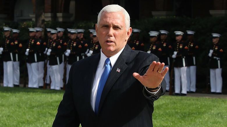 Mike Pence holding out hand