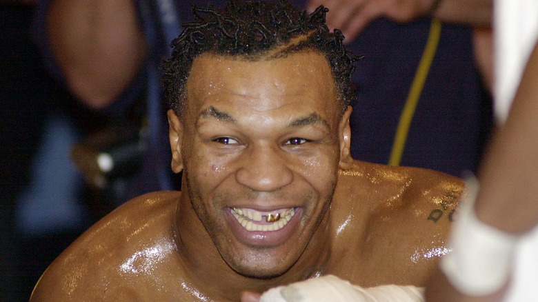 Mike Tyson smiling during a fight