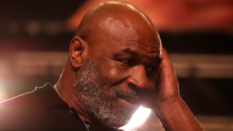 Mike Tyson with hand on side of face