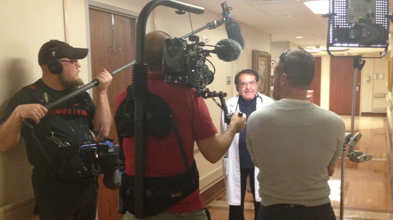 Camera crew filming interview with Dr. Now