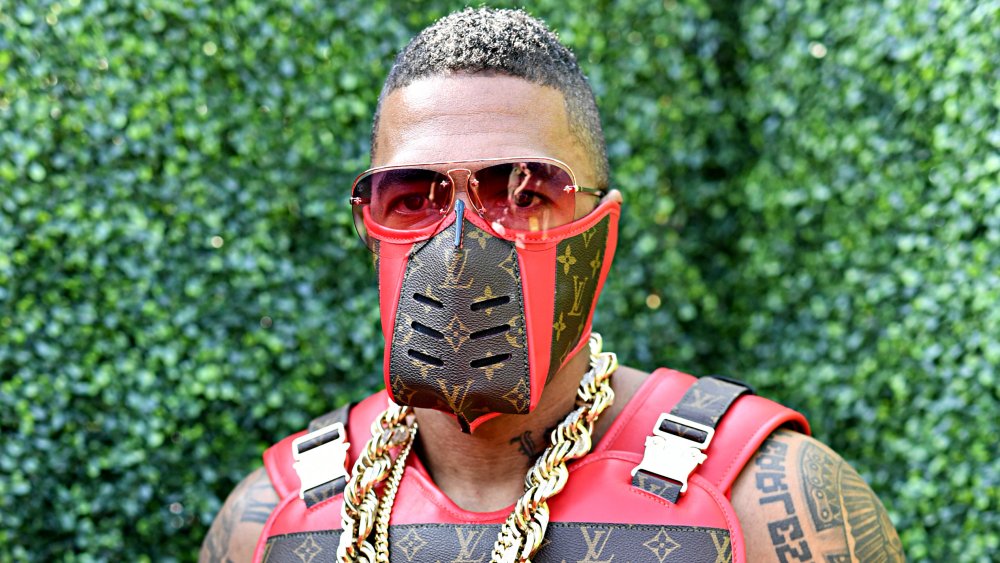 Nick Cannon in a Louis Vuitton facemask and vest at the 2019 MTV Movie and TV Awards 