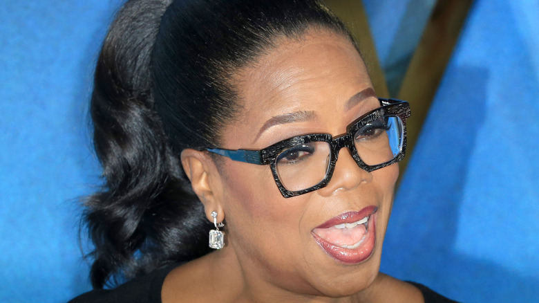 Oprah Winfrey posing on red carpet