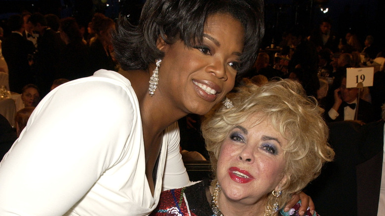 Oprah Winfrey and Elizabeth Taylor posing