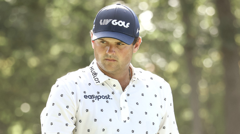 Patrick Reed looking away, angry