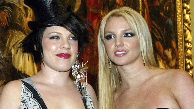 Pink posing with Britney Spears