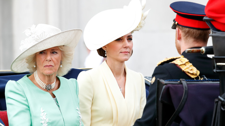 Camilla, Kate Middleton, and Prince Harry in carriage