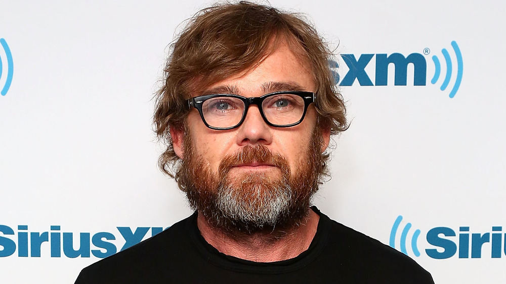 Ricky Schroder in front of SiriusXM promo wall