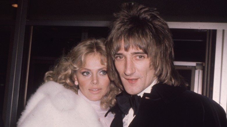 Britt Eckland and Rod Stewart cuddling