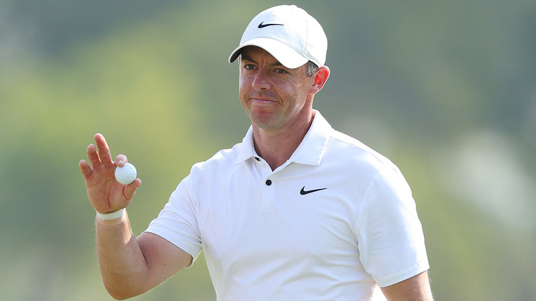 Rory McIlroy holding a golfball