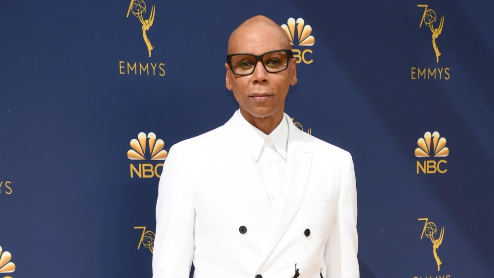 RuPaul in white suit and shirt