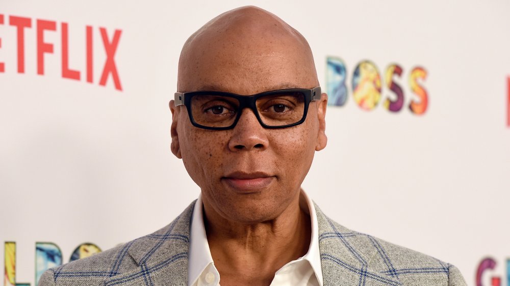 RuPaul with black-rimmed glasses 