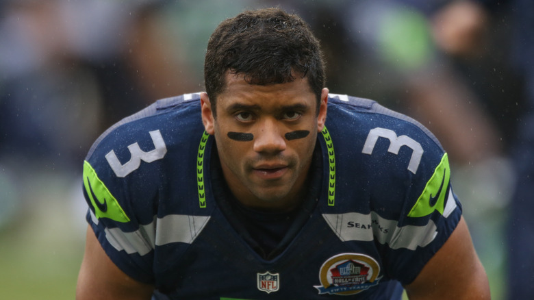 Russell Wilson wearing Seatle Seahawks uniform