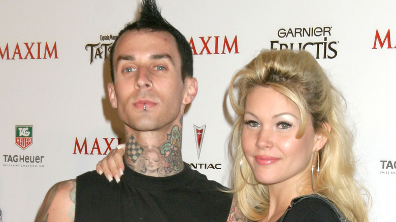 Shanna Moakler's arm around Travis Barker