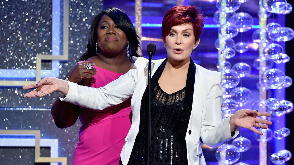 Sheryl Underwood and Sharon Osbourne presenting at an award show 