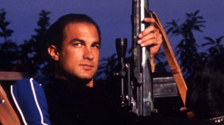 Steven Seagal holding semiautomatic rifle