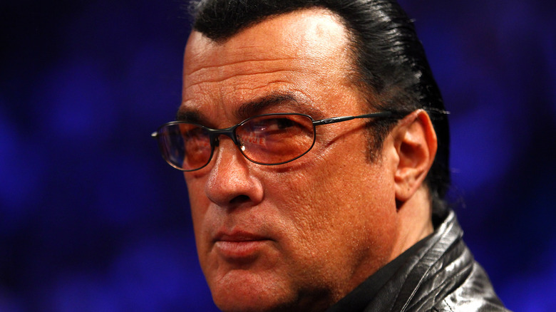 Steven Seagal wearing glasses glaring at camera