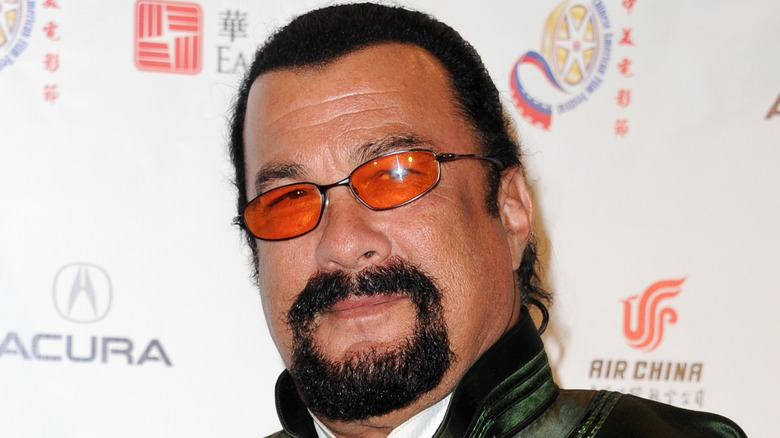 Steven Seagal wearing orange glasses