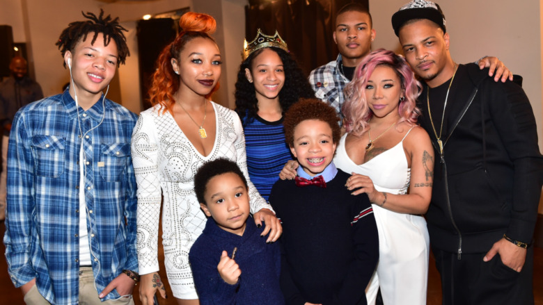 (L-R) Domani Harris, Zonnique Pullins, Deyjah Harris, Messiah Harris, T.I., Tameka "Tiny" Harris, King Harris and Major Harris attend T.I. & Tameka "Tiny" Harris all smiling