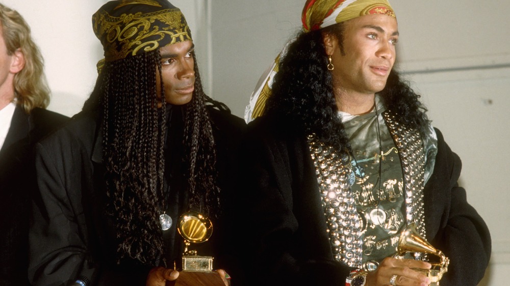 Milli Vanilli holding Grammys