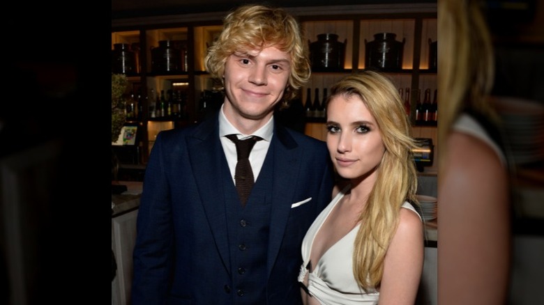 Evan Peters and Emma Roberts smiling together