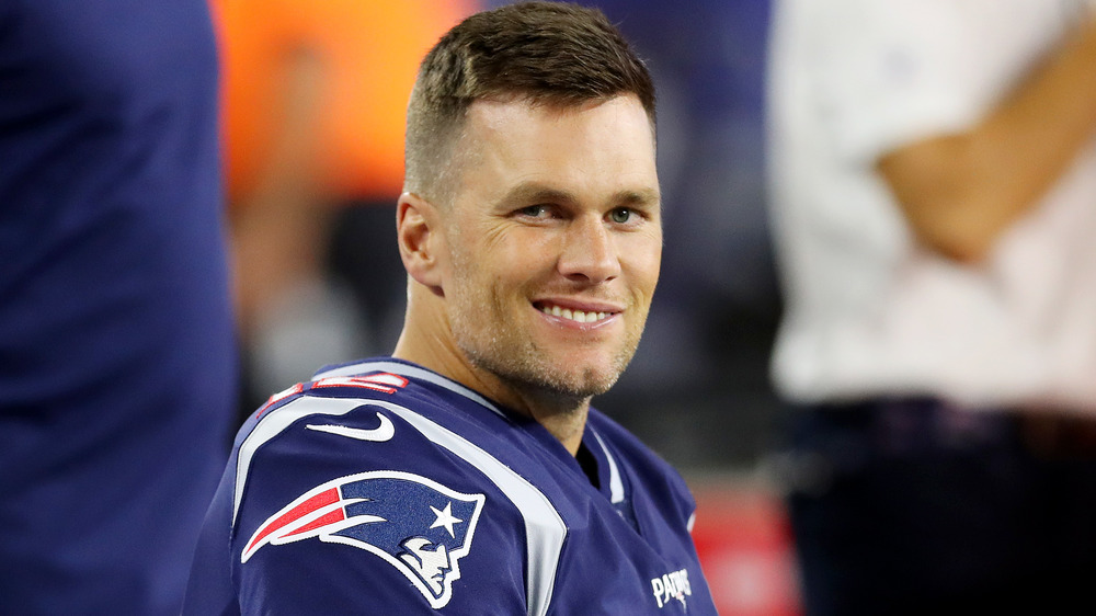 Tom Brady smirking in uniform