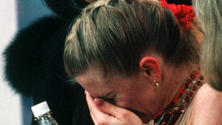 Tonya Harding crying into hand