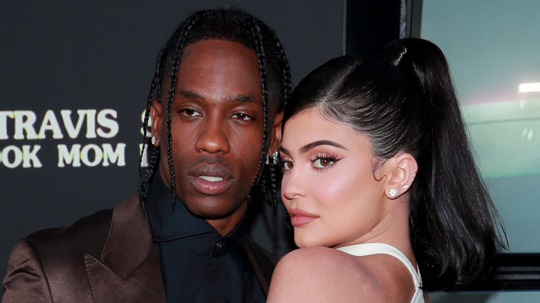 Travis Scott posing with Kylie Jenner