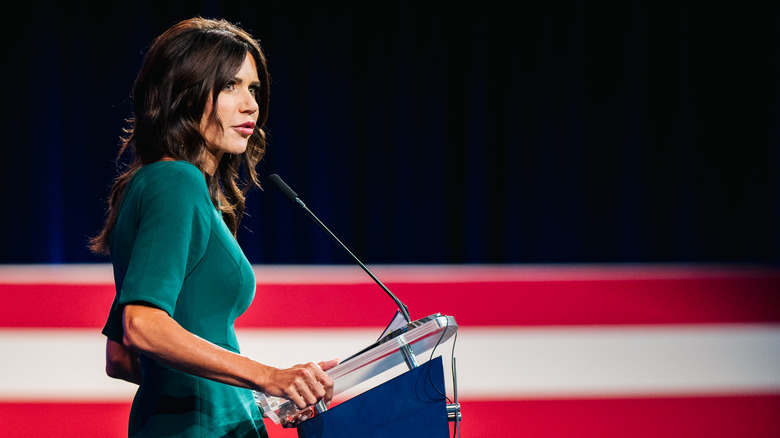 Kristi Noem at a podium 