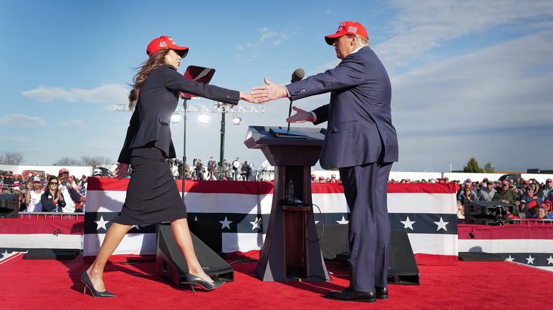 Kristi Noem and Donald Trump on stage